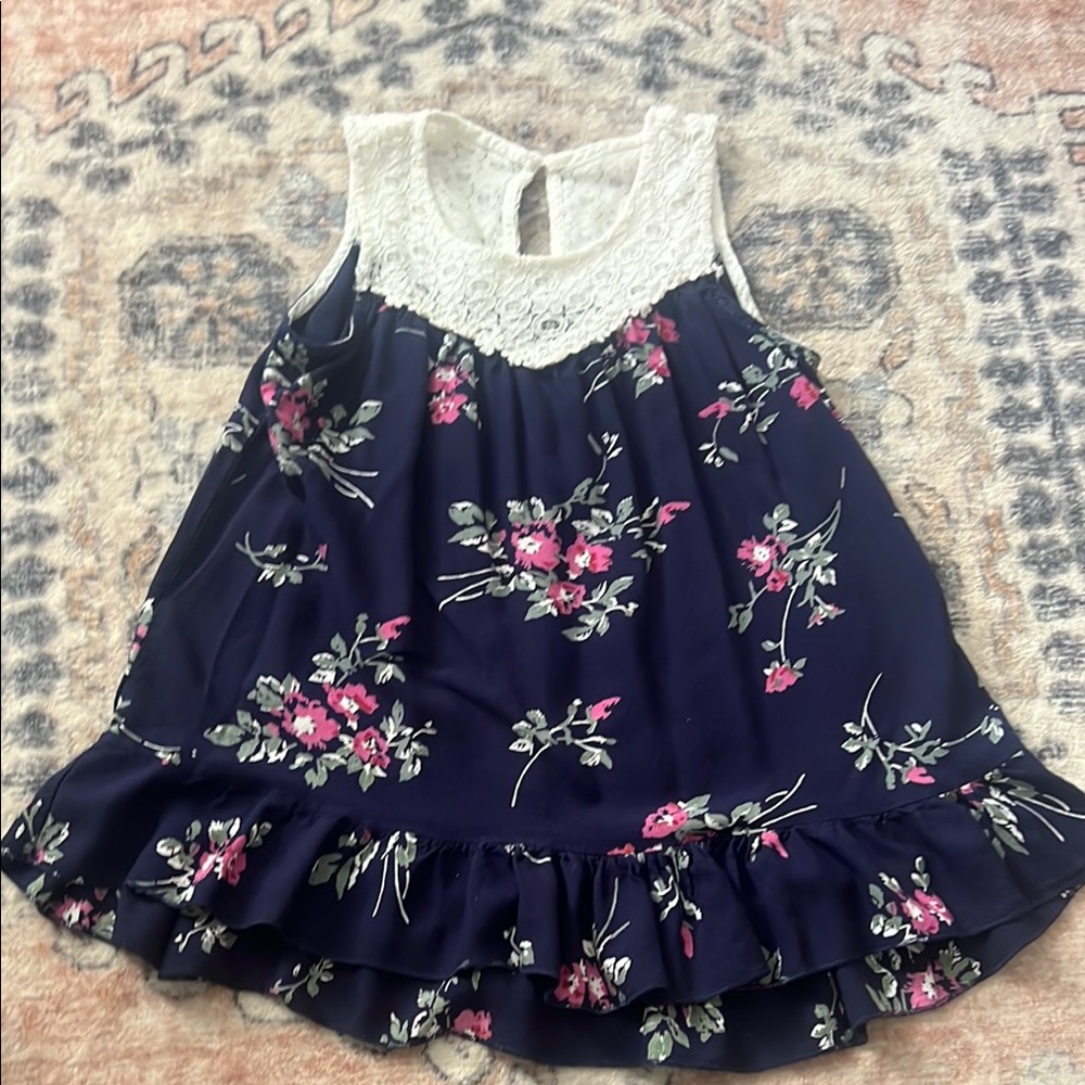 Blue and White Floral Blouse with Ruffled Hem